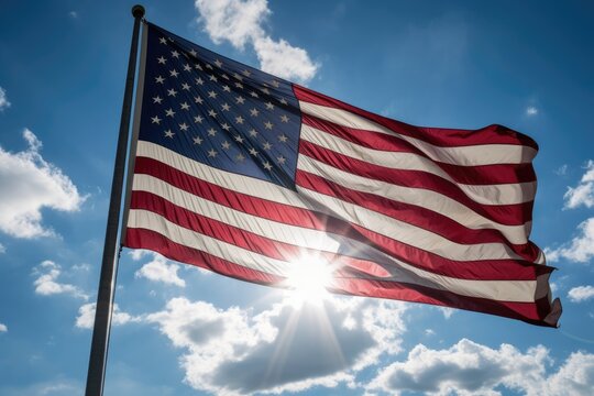 Powerful image of the American flag, blowing in the wind displayed against a clear blue sky. Generative Ai