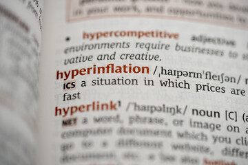 close up of a dictionary with the definition of the word hyperinflation