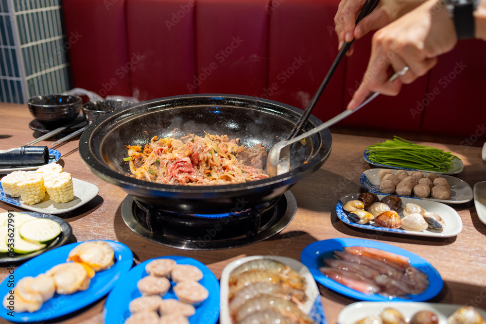 Canvas Prints Hotpot with fresh slice of meat and food in restaurant