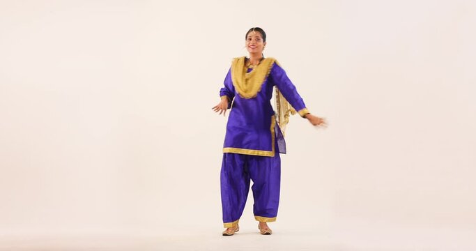 Sikh Woman performing bhangra during Baisakhi Celebration