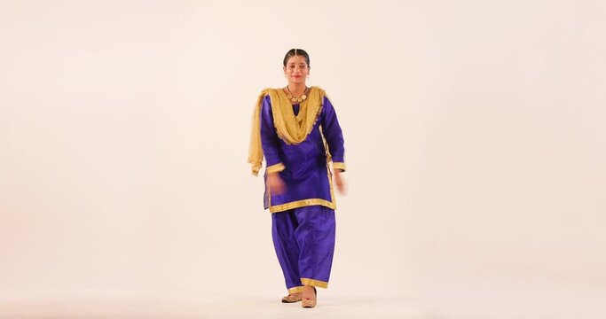 Sikh Woman performing bhangra during Baisakhi Celebration