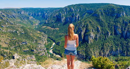 Woman standing on top of mountain- Aveyron, Tarn, Lozere in France