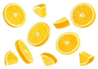 Fresh oranges pattern. Round slices and pieces fruits fly and levitation on white background,...