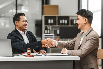 Two disgusting businessmen Asian lawyer of Indian descent paying attention to mistakes, proposing corrections. Businessman discussing contract policy terms with client, rights of liberty concept.