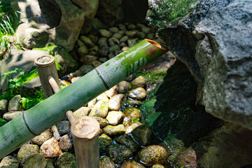 A Japanese Bamboo Water Fountain Shishi-Odoshi in Zen Garden