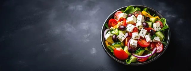 Tuinposter Greek salad with fresh vegetables, feta cheese and black olives on a dark background Generative AI © Irina