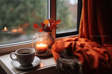 Foto op Aluminium Autumn cozy mood. Fall cozy reading nook with a blanket, bookshelf filled with autumn-themed books, and a cup of tea or hot chocolate. © irissca