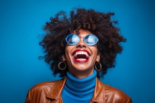 Vintage Vibes: Friends Laughing and Smiling Against Blue Background. Black Arts Movement Influence with Colorful, Eye-Catching Composition. Light Indigo and Amber Tones. High-Angle Capture