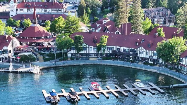 lake arrowhead village telephoto aerial compression over the village and marina with boat docks on a sunny summer day with dramatic shadows - AERIAL ORBIT