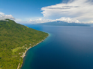Tropical Island with blue sea. Blue sky and clouds. Camiguin, Philippines.
