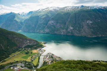 View from Stegastein viewpoint on the picturesque town of Flam in the Flomsdalen valley and Aurlandsfjord, Norway.