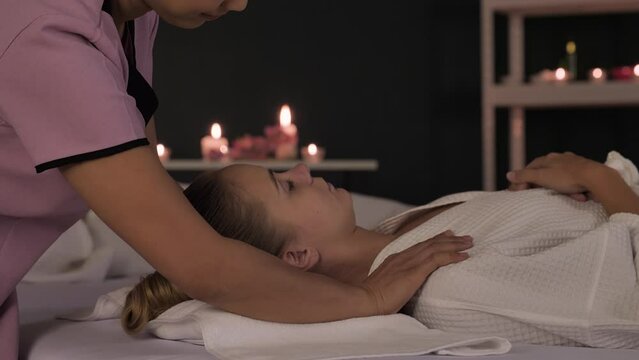Relaxing Massage, a Woman Indulge in relaxation as a skilled therapist eases muscle tension with a soothing massage at a health beauty spa. 