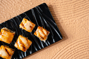 sushi is a Japanese dish of prepared vinegared rice, usually with some sugar and salt, accompanied by a variety of ingredients such as seafood, often raw and vegetables.