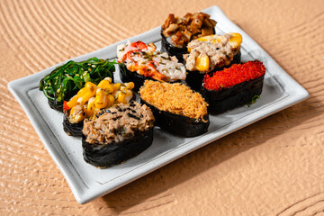 sushi is a Japanese dish of prepared vinegared rice, usually with some sugar and salt, accompanied by a variety of ingredients such as seafood, often raw and vegetables.