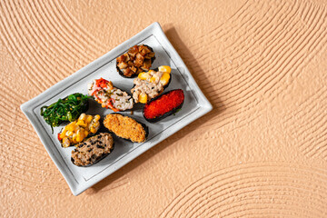 sushi is a Japanese dish of prepared vinegared rice, usually with some sugar and salt, accompanied by a variety of ingredients such as seafood, often raw and vegetables.