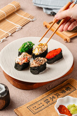 sushi is a Japanese dish of prepared vinegared rice, usually with some sugar and salt, accompanied by a variety of ingredients such as seafood, often raw and vegetables.