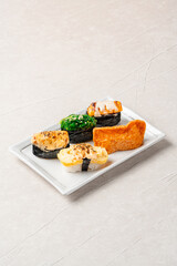 sushi is a Japanese dish of prepared vinegared rice, usually with some sugar and salt, accompanied by a variety of ingredients such as seafood, often raw and vegetables.