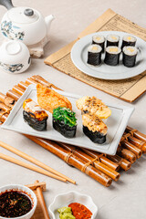 sushi is a Japanese dish of prepared vinegared rice, usually with some sugar and salt, accompanied by a variety of ingredients such as seafood, often raw and vegetables.