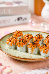 sushi is a Japanese dish of prepared vinegared rice, usually with some sugar and salt, accompanied by a variety of ingredients such as seafood, often raw and vegetables.