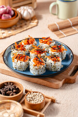 sushi is a Japanese dish of prepared vinegared rice, usually with some sugar and salt, accompanied by a variety of ingredients such as seafood, often raw and vegetables.