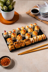 sushi is a Japanese dish of prepared vinegared rice, usually with some sugar and salt, accompanied by a variety of ingredients such as seafood, often raw and vegetables.