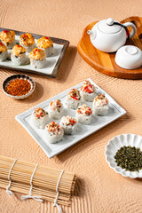 sushi is a Japanese dish of prepared vinegared rice, usually with some sugar and salt, accompanied by a variety of ingredients such as seafood, often raw and vegetables.