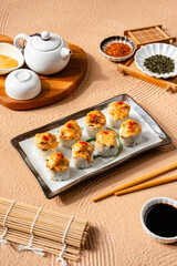 sushi is a Japanese dish of prepared vinegared rice, usually with some sugar and salt, accompanied by a variety of ingredients such as seafood, often raw and vegetables.