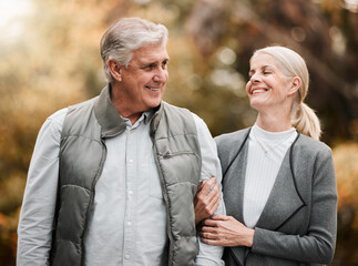 Happy, love and peace with old couple in nature for bonding, relax and support. Smile, happiness and retirement with senior man and woman walking in countryside park for vacation and commitment
