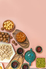 a tasty round moon cakes at mid autumn festival. Flat lay mid autumn festival food and drink on sweet pink background.