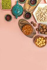 a tasty round moon cakes at mid autumn festival. Flat lay mid autumn festival food and drink on sweet pink background.