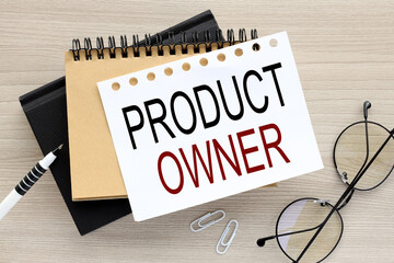 the words PRODUCT OWNER on a white page on two notepads