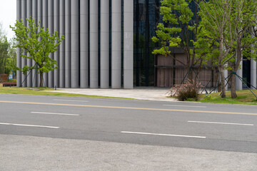 empty concrete floor in front of modern buildings in the downtown street.