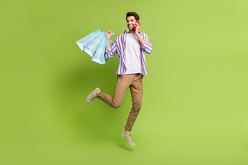 Full size body photo of funky shopaholic guy call smartphone dialogue with bargains hobby brand...