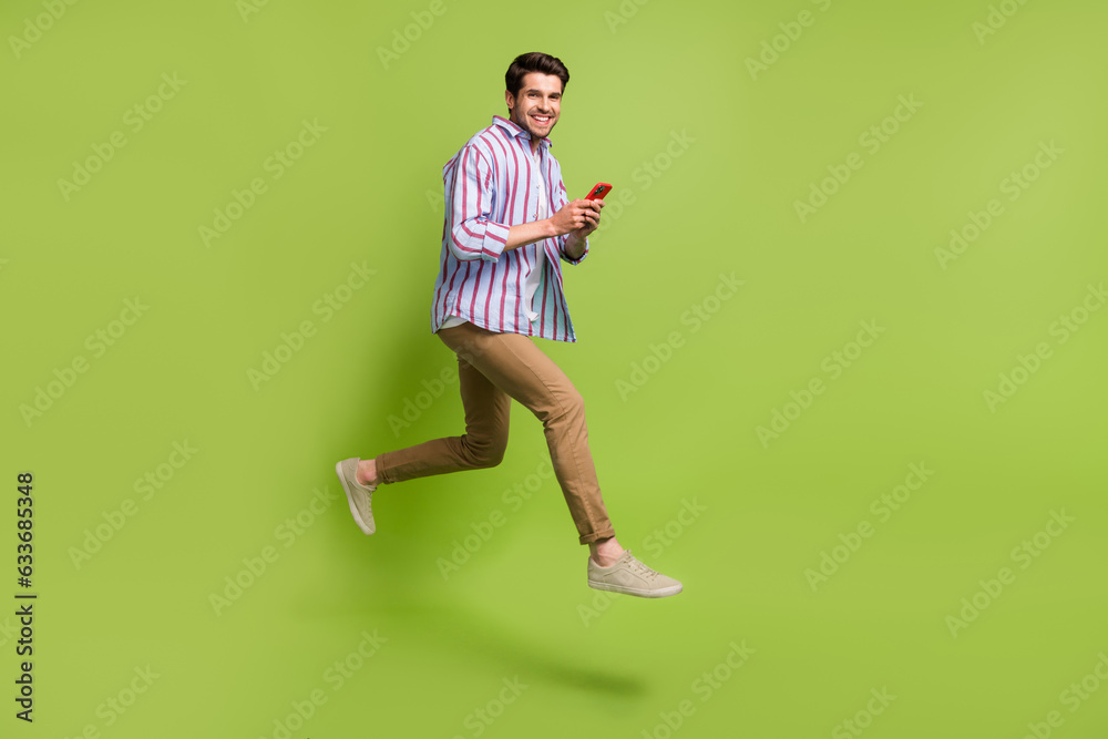 Aufkleber full size photo of funky person wear stylish clothes hold smartphone run shopping at empty space iso