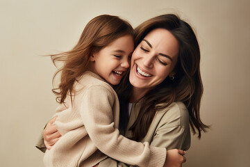 Playful loving mother and daughter smiling out of joy. Happiness concept