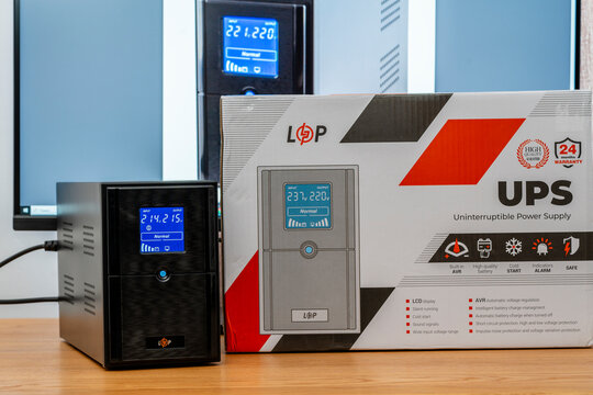Unboxed new UPS LogicPower LPM-UL1550VA on office table. Logic Power is a leading manufacturer of backup power systems and alternative energy sources
