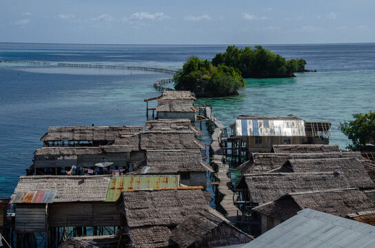 Bajo village in Malenge, Togian Islands, Sulawesi, Indonesia. Sea gipsy. 
A village built on stilts on the sea.