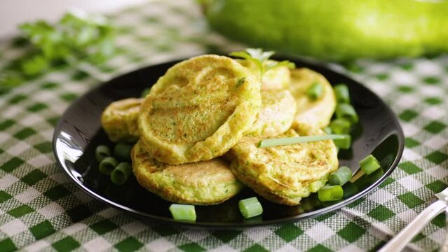 Fried squash green pancakes in a plate.