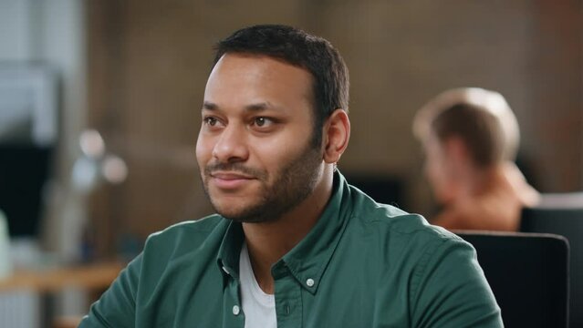 Smiling employee thinking career perspectives sitting office open space closeup.