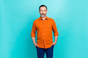 Photo of confident pensioner businessman bank owner posing for his magazine newspaper successful person isolated on cyan color background