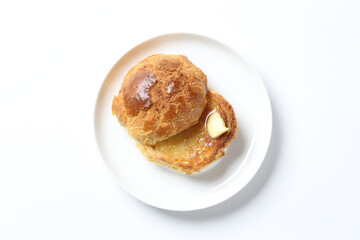 Hong Kong crispy skin polo bun toast with butter and honey jam breakfast in plate on white background western chef appetiser halal bakery food restaurant pastry menu for cafe