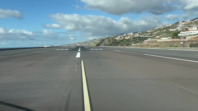 Initial Take-off roll from Funchal Airport, Madeira Island ( Portyugal), as seen by the pilots in a real time take-off runway 23