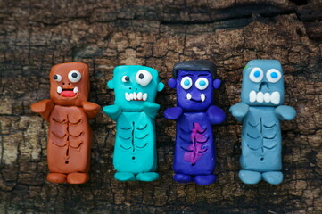 Funny monsters made of plasticine. Various figures. Ideas for Halloween.