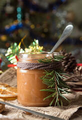 Jar of salt caramel and Christmas New Year decorations.