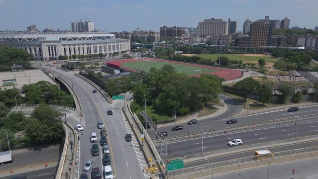 alt aerial shot of Yankee Stadium pulling back along Macombs Dam Bridge