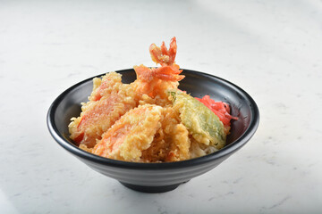 japanese deep fried crispy tempura prawn and vegetables rice in black bowl on wood tray white marble table background chef cook healthy poke bowl halal vegan food menu for cafe