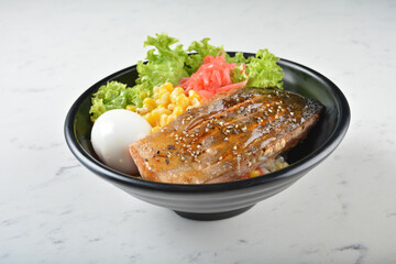 japanese bbq grill teriyaki salmon seafood with boiled onsen egg, corn, red ginger and rice in black bowl on wood tray white marble table background chef cook healthy poke bowl halal food menu