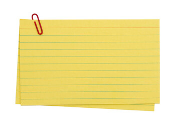 Retro yellow paper index cards stack with paper clip isolated on white