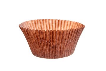 Empty cupcake baking case isolated on white background. Brown paper baking cup. Single muffin case, cupcake liner