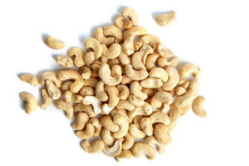 Cashew nut heap isolated on white background, top view. A wholesome nut snack
